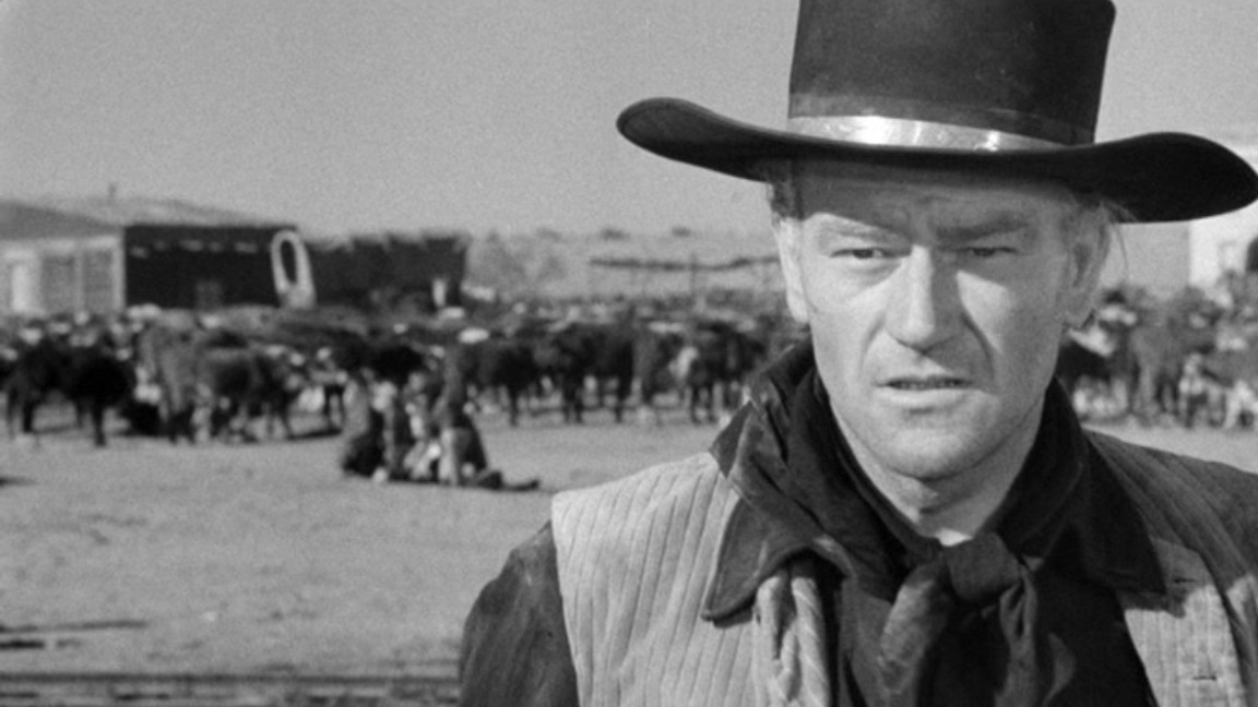 John Wayne è Tom Dunson in un momento de Il fiume rosso