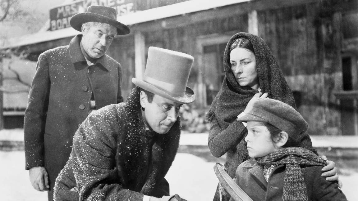 Agnes Moorehead, George Coulouris, Harry Shannon e Buddy Swan in una scena del film